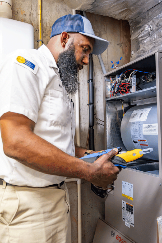 Wisler heating expert testing a furnace.
