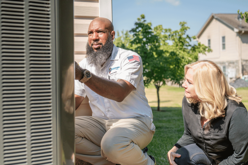 Wisler AC expert showing customer the issue with her Air Conditioner.