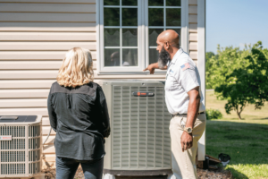 Wisler AC technician showing customer her new AC installation.