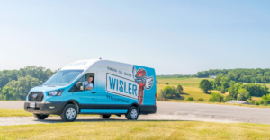 Wisler truck driving to a water heater repair.